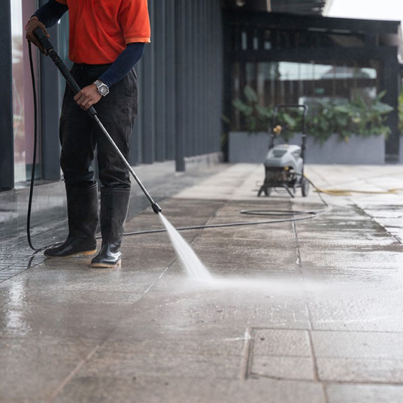 cleaning-staff-hoses-portable-car-washing-concrete-floor-with-highpressure-water-jets